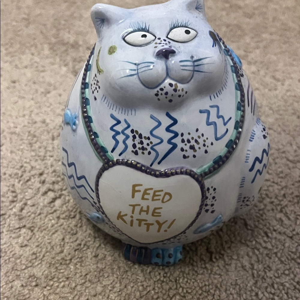 Whimsical Ceramic Cat Figurine coin bank.